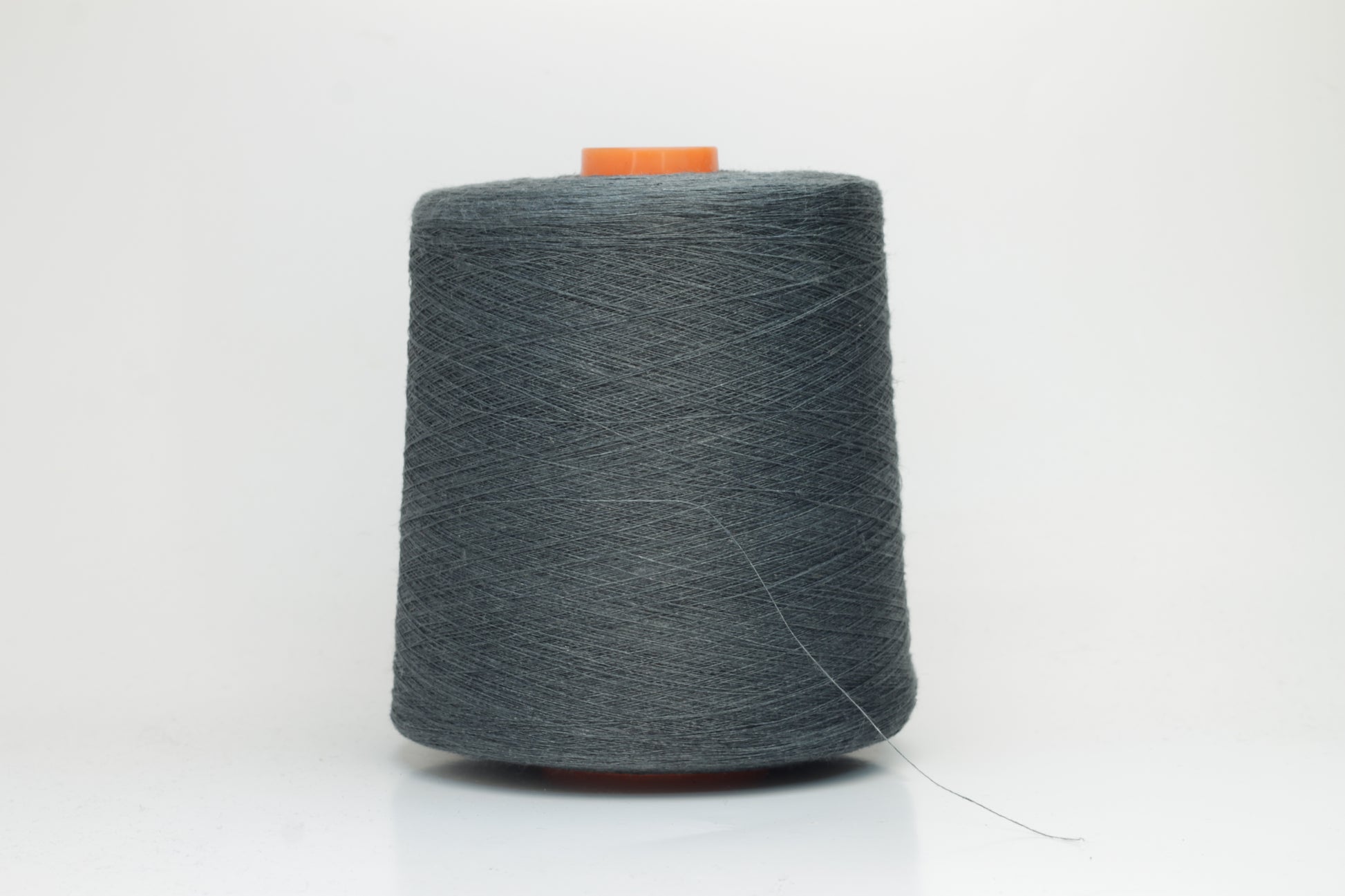 Fine, single-ply linen yarn in a rich Deep Sage Charcoal. Reveals a crisp texture and subtle natural sheen, typical of pure linen fiber.