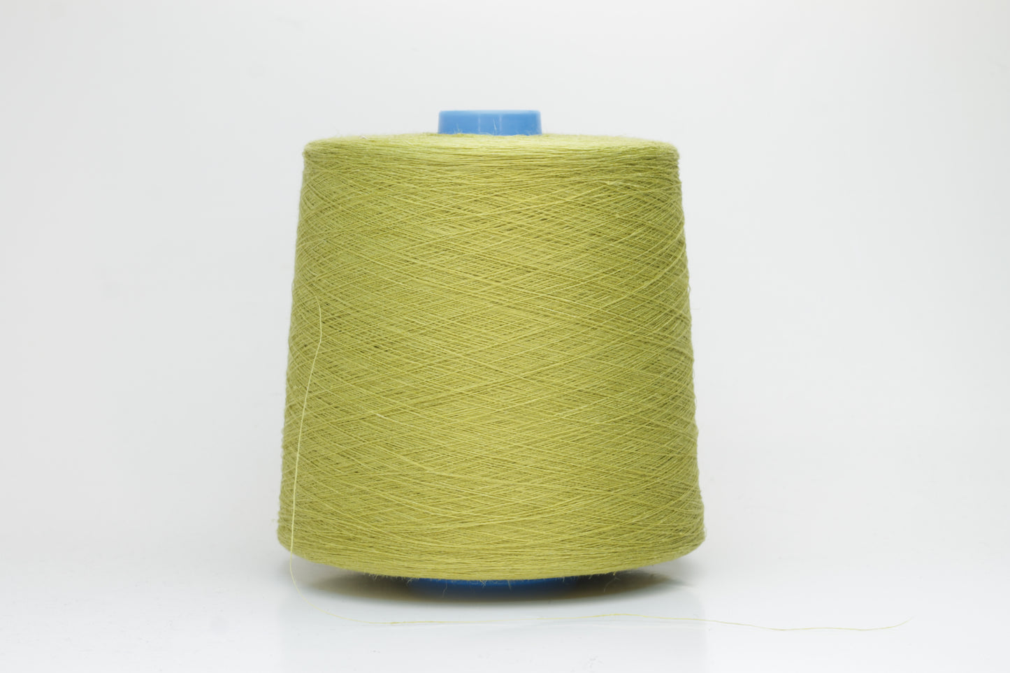 Fine, single-ply linen yarn in a rich Pistachio. Reveals a crisp texture and subtle natural sheen, typical of pure linen fiber.