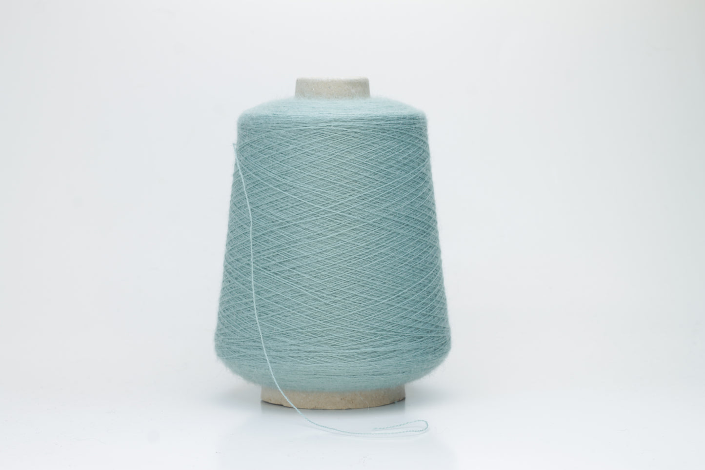 Dusty Mint 2-ply Alpaca Merino yarn, softly twisted with a gentle halo and subtle sheen, showcasing its deep, luxurious color saturation.