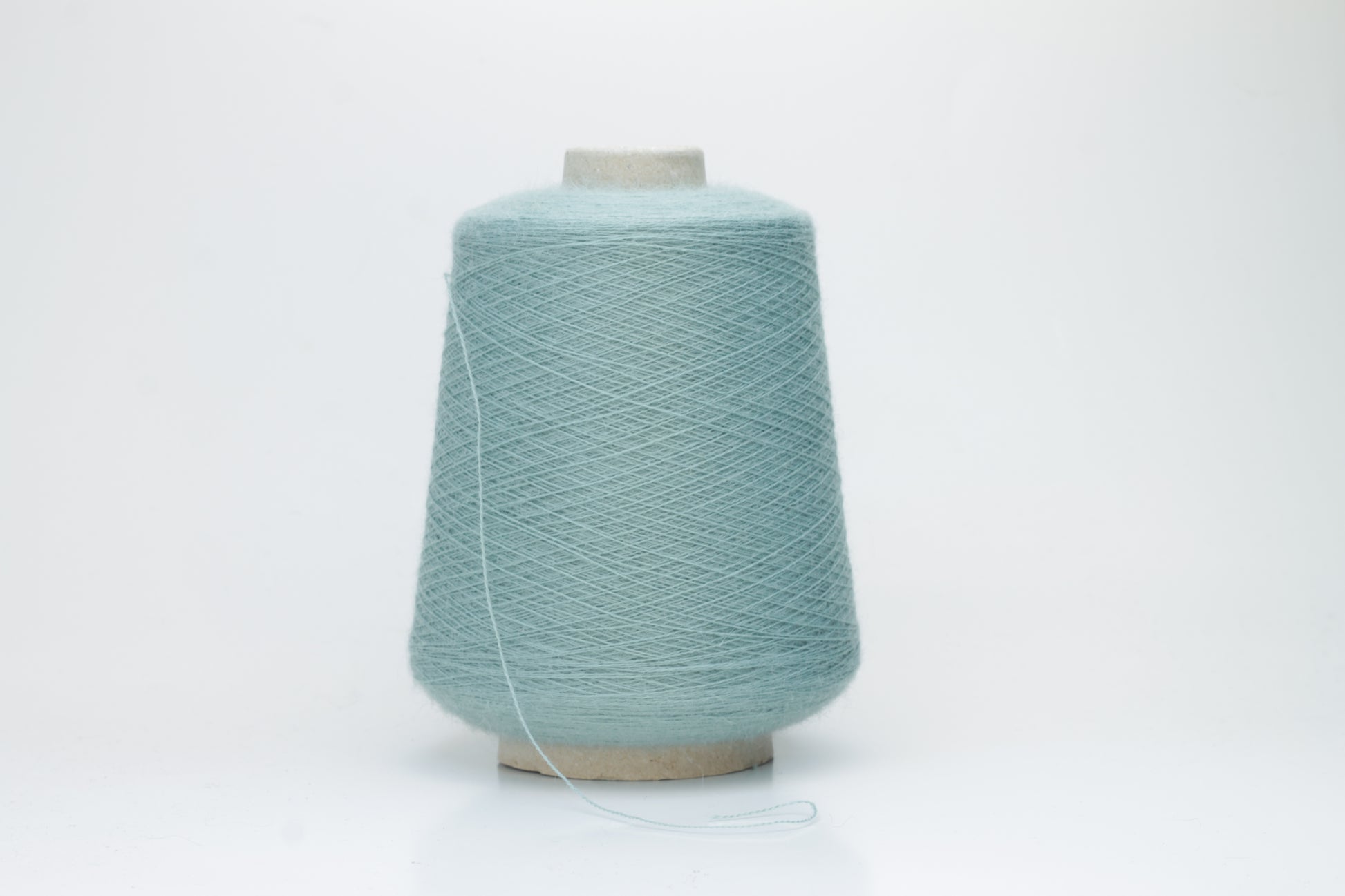Dusty Mint 2-ply Alpaca Merino yarn, softly twisted with a gentle halo and subtle sheen, showcasing its deep, luxurious color saturation.