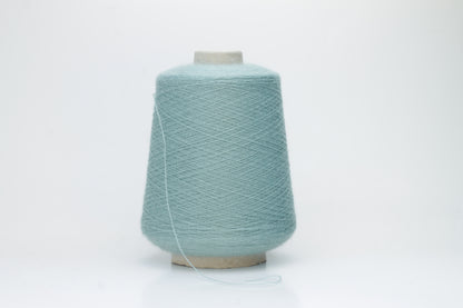 Dusty Mint 2-ply Alpaca Merino yarn, softly twisted with a gentle halo and subtle sheen, showcasing its deep, luxurious color saturation.