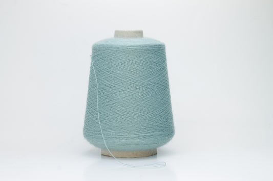 Dusty Mint 2-ply Alpaca Merino yarn, softly twisted with a gentle halo and subtle sheen, showcasing its deep, luxurious color saturation.