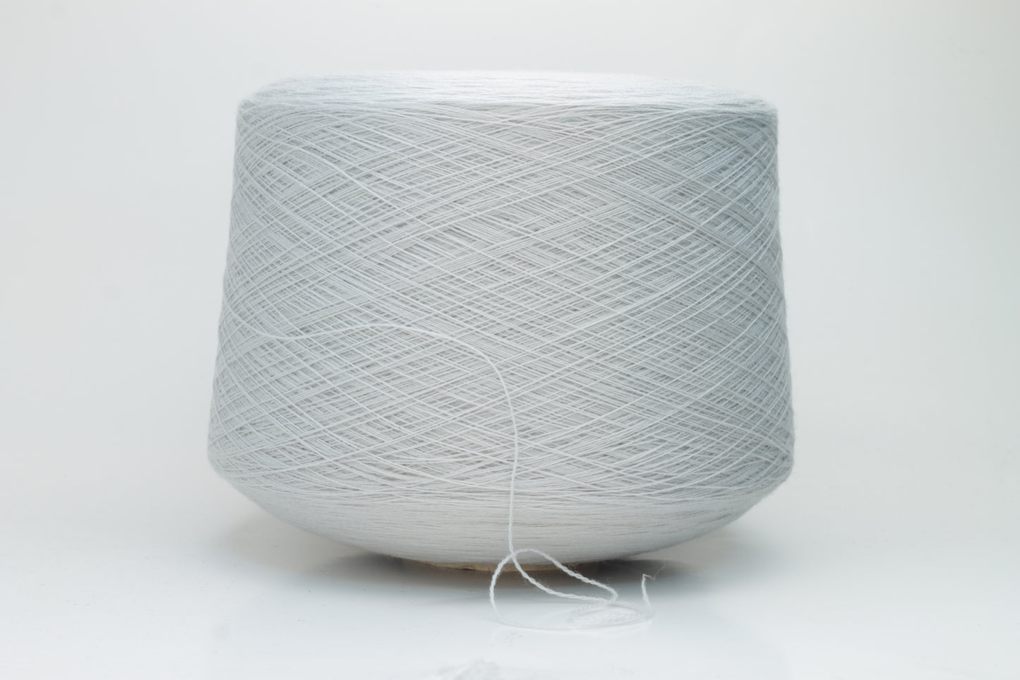 Close-up shot of Zegna Baruffa Merinos Cashwool yarn in Light Gray, showcasing the fine ply twist and dense, fluffy texture with subtle sheen.