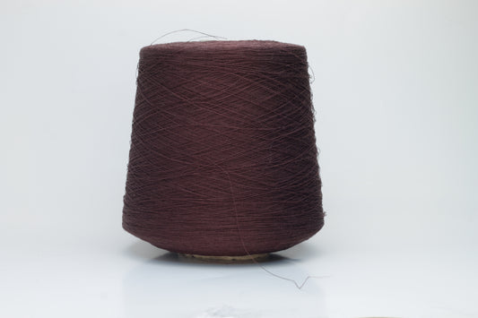 Close-up of a tightly twisted, fine-gauge yarn in a deep, warm earthy brown color, showing a subtle natural sheen from the linen fibers.