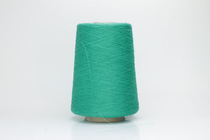 Fine, single-ply linen yarn in a rich Green. Reveals a crisp texture and subtle natural sheen, typical of pure linen fiber.