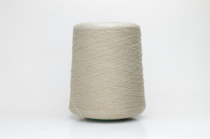 Fine, single-ply linen yarn in a rich Oatmeal. Reveals a crisp texture and subtle natural sheen, typical of pure linen fiber.