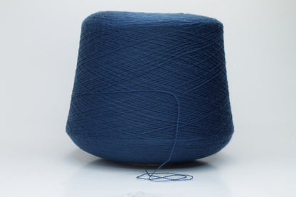 Close-up view of ZEGNA BARUFFA Merino 100% Cashwool, Nm 2/30, Color Blue. The yarn showcases a tight, even ply twist with a dense thread structure and subtle sheen reflecting the deep blue color, presenting a fluffy and inviting texture.