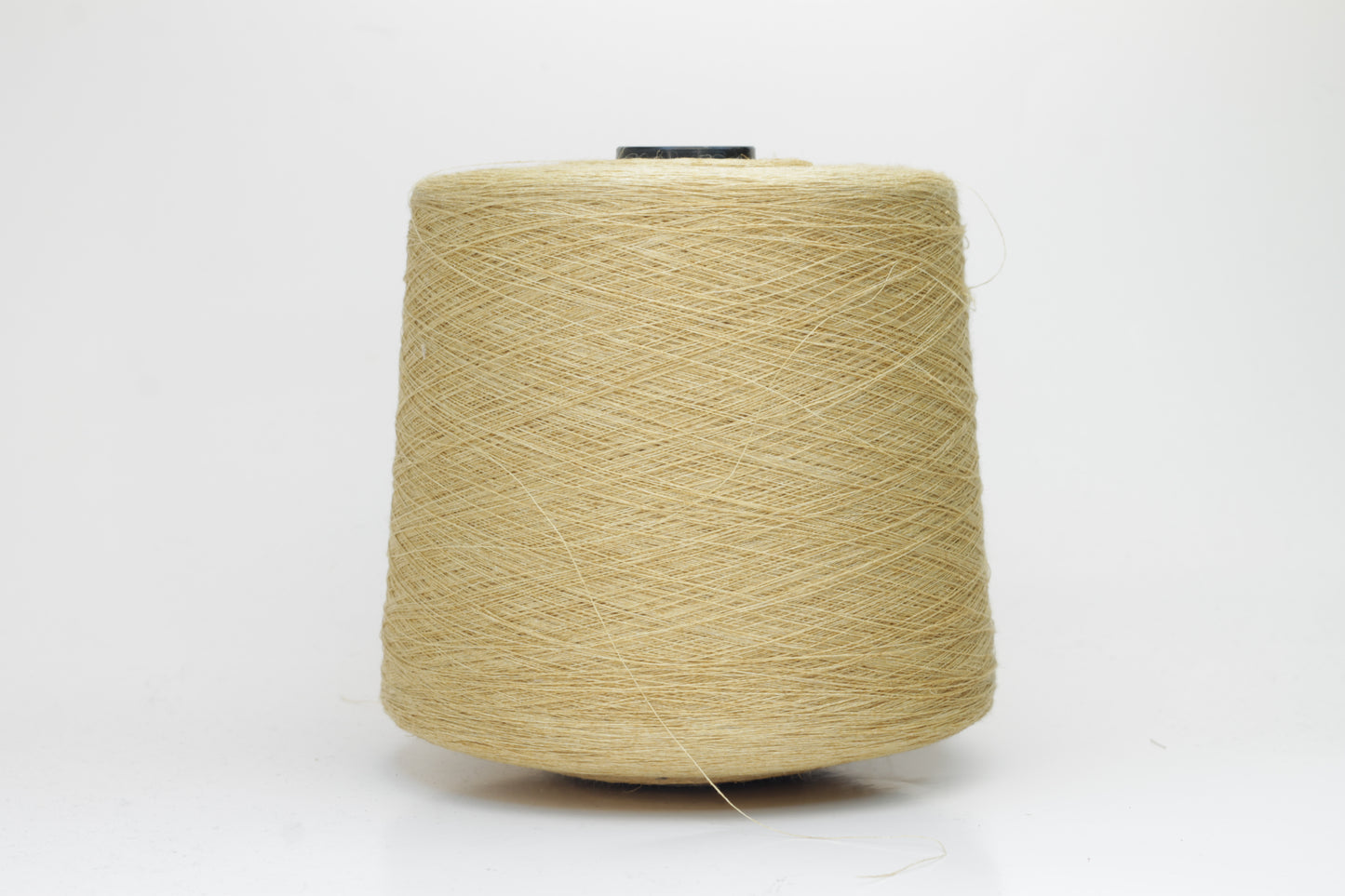 Fine, single-ply linen yarn in a rich Pale Butter. Reveals a crisp texture and subtle natural sheen, typical of pure linen fiber.
