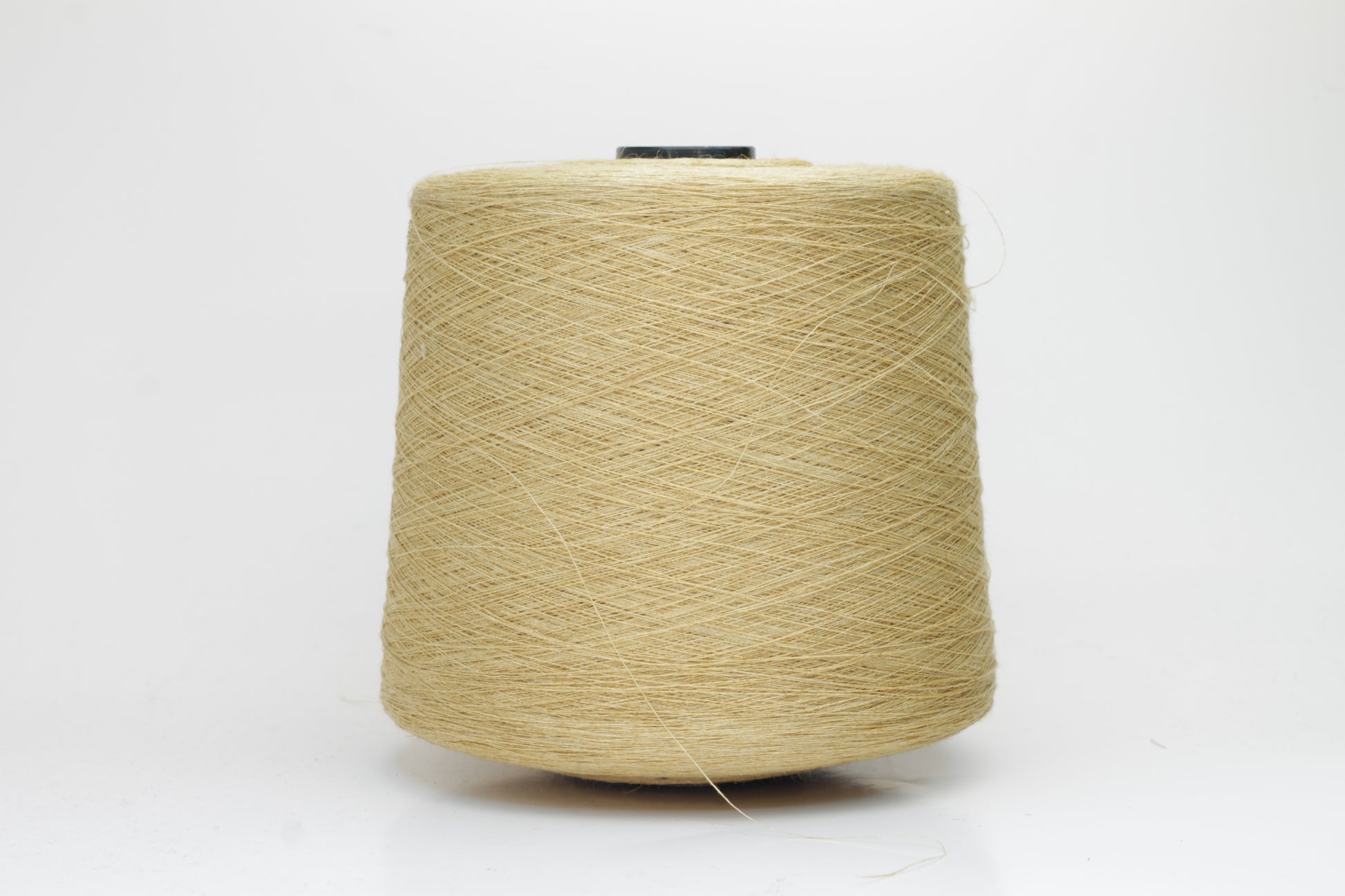 Fine, single-ply linen yarn in a rich Pale Butter. Reveals a crisp texture and subtle natural sheen, typical of pure linen fiber.