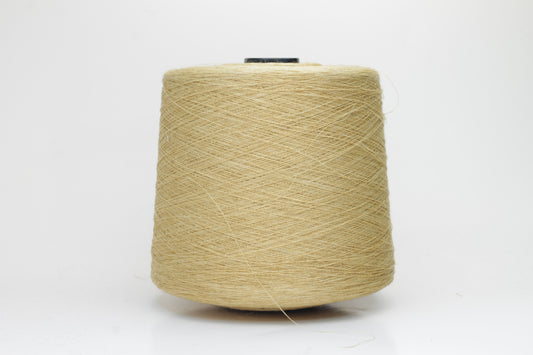 Fine, single-ply linen yarn in a rich Pale Butter. Reveals a crisp texture and subtle natural sheen, typical of pure linen fiber.