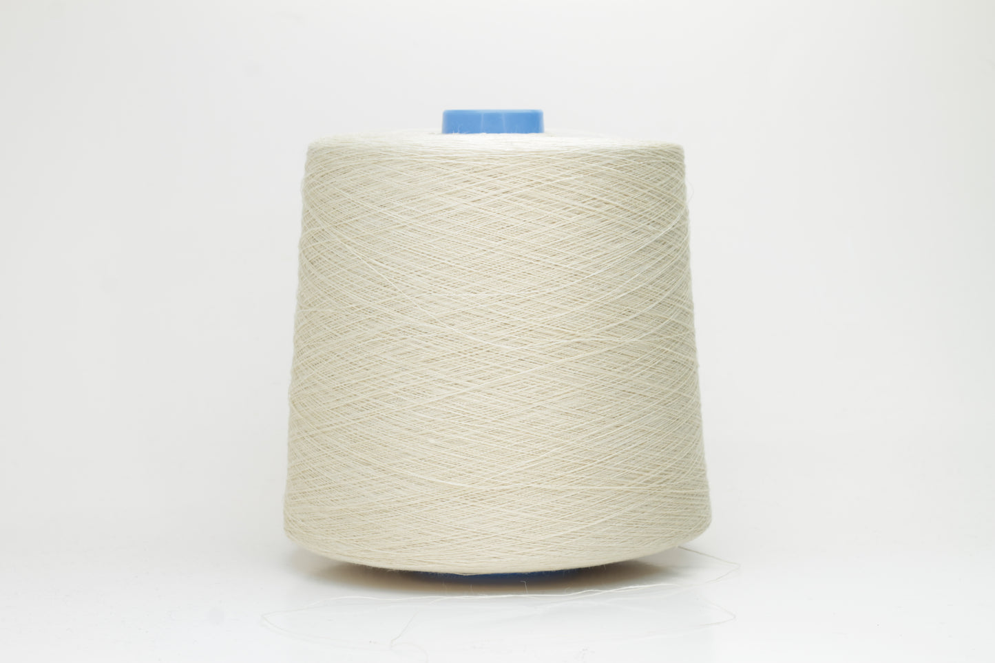 Fine, single-ply linen yarn in a rich Cera. Reveals a crisp texture and subtle natural sheen, typical of pure linen fiber.