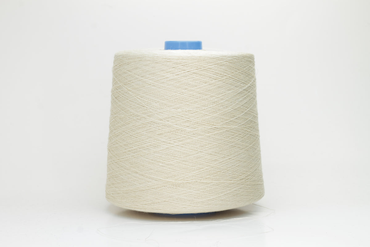 Fine, single-ply linen yarn in a rich Cera. Reveals a crisp texture and subtle natural sheen, typical of pure linen fiber.
