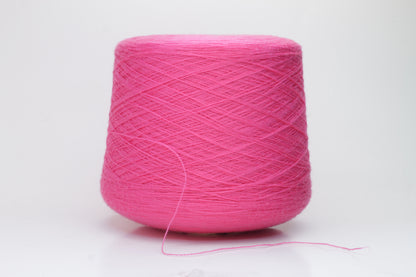 Close-up view of vibrant hot pink Zegna Baruffa Merino Cashwool yarn, showcasing its smooth, twisted ply structure and rich color depth.