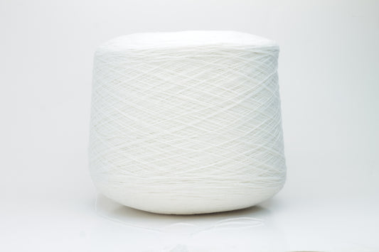 Close-up of a pristine white, two-ply cashmere yarn ball, subtly glowing with a luxurious, fine-fibered halo.