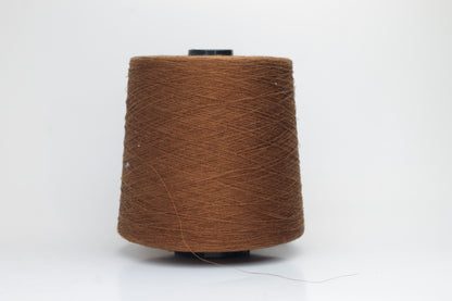 Fine, single-ply linen yarn in a Mostarda. Reveals a crisp texture and subtle natural sheen, typical of pure linen fiber.