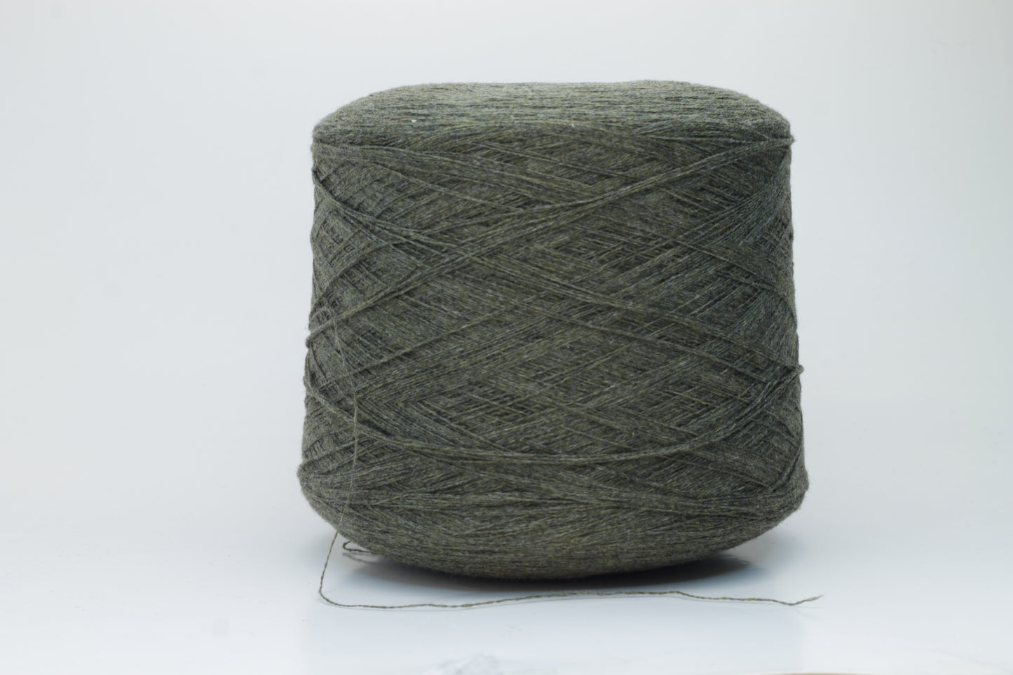 Close-up of a skein of luxurious 100% cashmere yarn in a deep Borneo brown, showcasing its soft, slightly matte sheen and subtle halo.