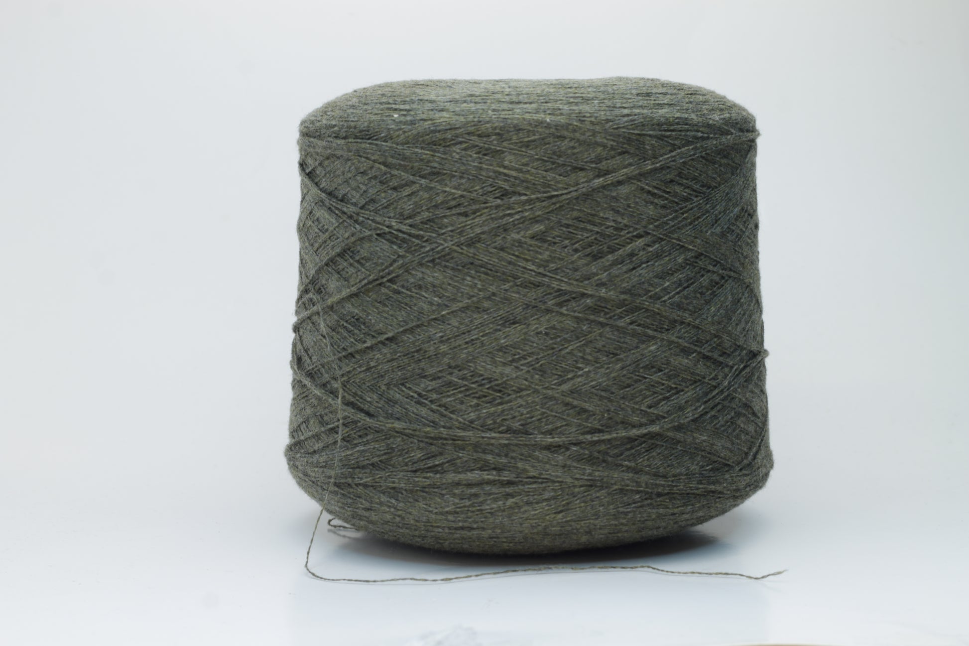 Close-up of a skein of luxurious 100% cashmere yarn in a deep Borneo brown, showcasing its soft, slightly matte sheen and subtle halo.