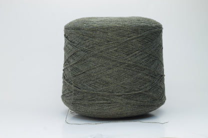 Close-up of a skein of luxurious 100% cashmere yarn in a deep Borneo brown, showcasing its soft, slightly matte sheen and subtle halo.