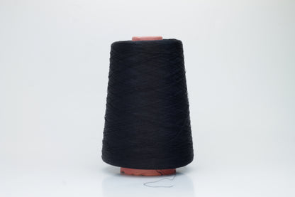 A single, tightly spun strand of incredibly fine, jet black silk yarn, showcasing a brilliant, almost glass-like sheen.