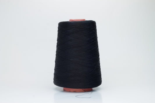 A single, tightly spun strand of incredibly fine, jet black silk yarn, showcasing a brilliant, almost glass-like sheen.