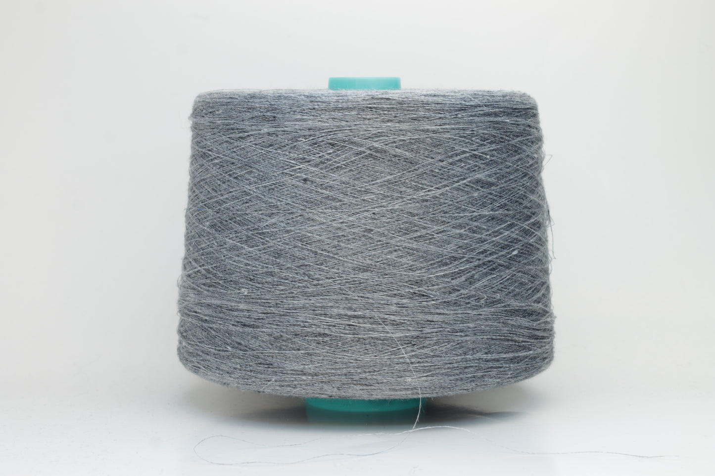 Fine, single-ply linen yarn in a rich Slate Blue-Gray. Reveals a crisp texture and subtle natural sheen, typical of pure linen fiber.