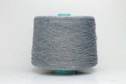 Fine, single-ply linen yarn in a rich Slate Blue-Gray. Reveals a crisp texture and subtle natural sheen, typical of pure linen fiber.