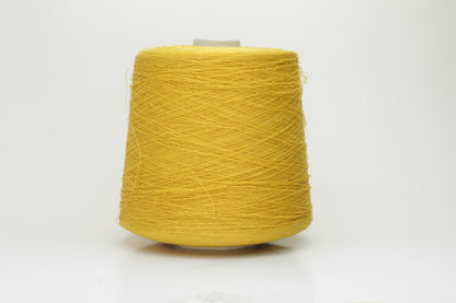 Close-up of a brightly twisted single-ply yarn, a sunny yellow color with a subtle matte finish and visible linen slubs throughout.