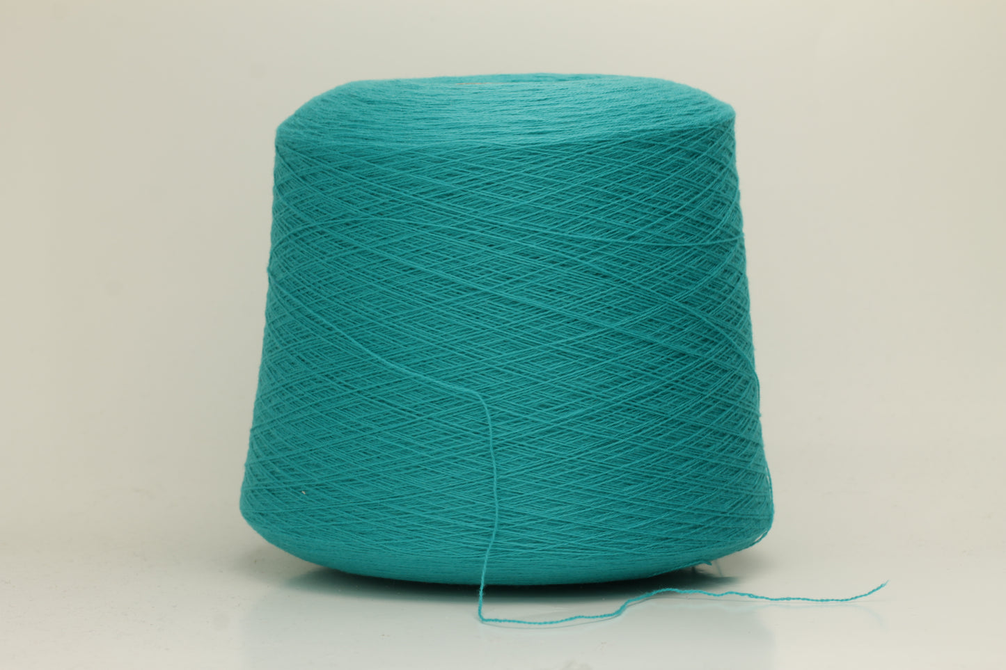 Vibrant grasshopper-green cashmere yarn. Soft, fine ply, subtle halo, and luxurious sheen. Displays rich, consistent color depth.
