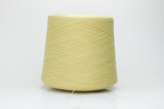 Close-up image of a vibrant yellow ZEGNA Baruffa merino yarn skein, showcasing its fine ply twist and dense thread structure with subtle sheen and inviting fluffiness.