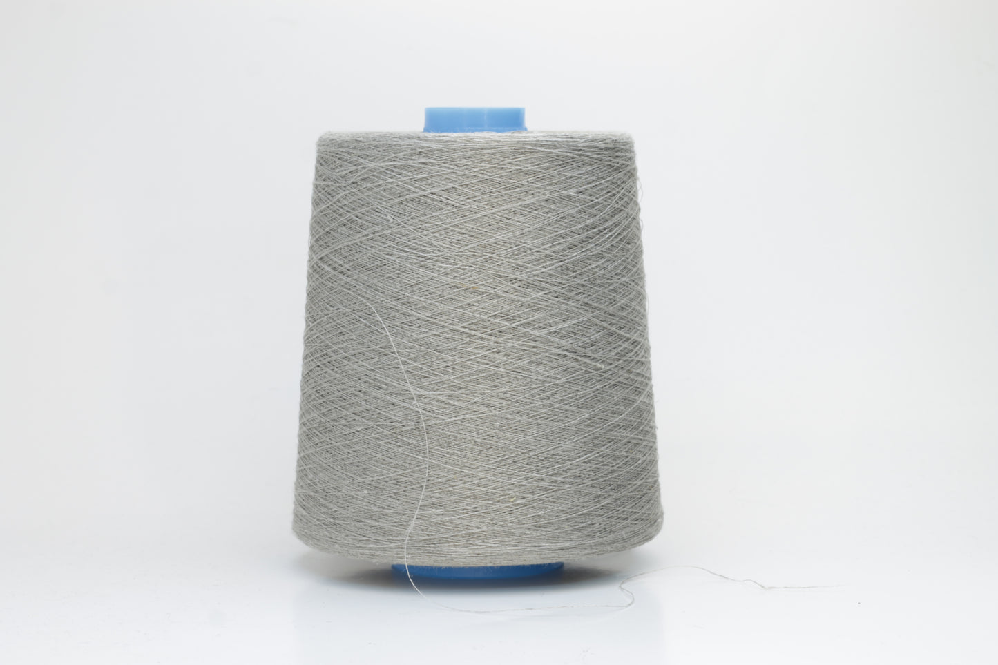 Fine, single-ply linen yarn in a Natural. Reveals a crisp texture and subtle natural sheen, typical of pure linen fiber.