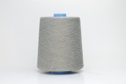 Fine, single-ply linen yarn in a Natural. Reveals a crisp texture and subtle natural sheen, typical of pure linen fiber.