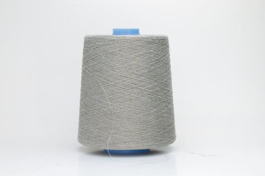 Fine, single-ply linen yarn in a Natural. Reveals a crisp texture and subtle natural sheen, typical of pure linen fiber.