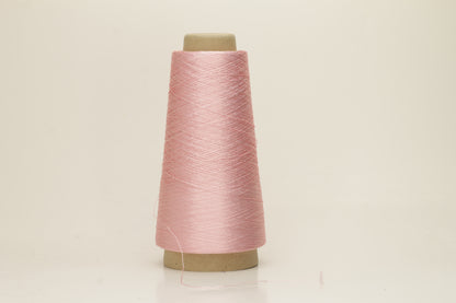 Close-up of pristine Rosa, finely plied 100% silk yarn, twisted smoothly to reveal a high, lustrous sheen and uniform structure.