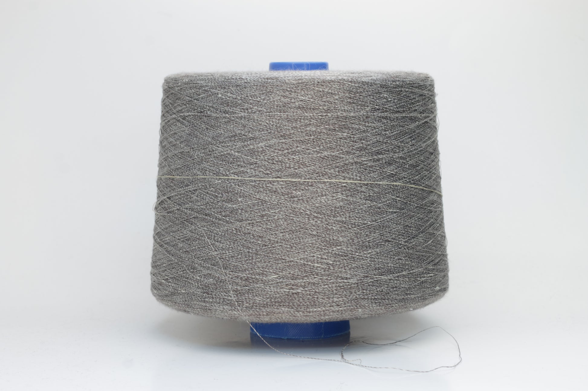 Fine, single-ply linen yarn in a rich Medium Heather Gray. Reveals a crisp texture and subtle natural sheen, typical of pure linen fiber.