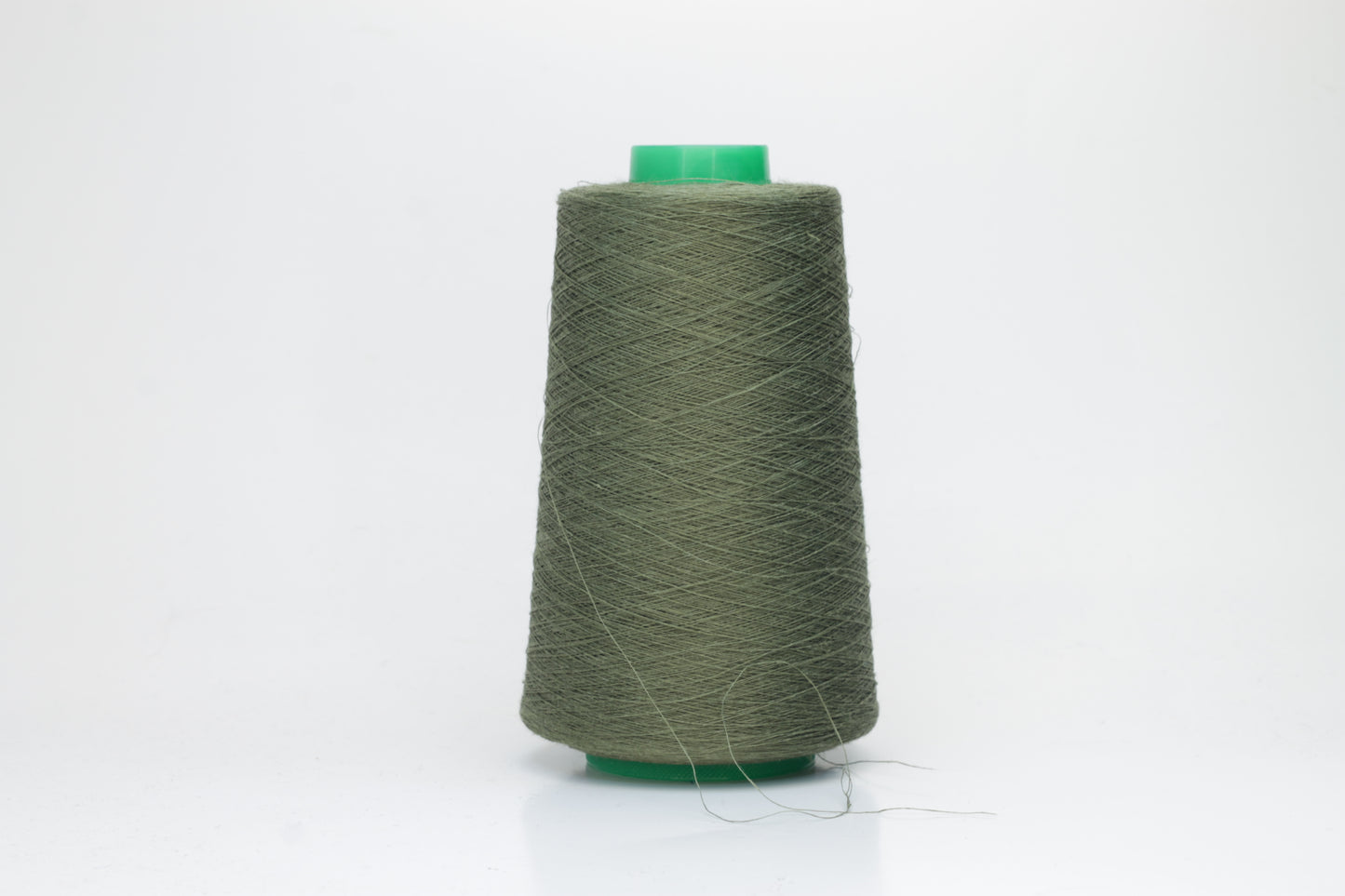 Fine, single-ply linen yarn in a rich Army. Reveals a crisp texture and subtle natural sheen, typical of pure linen fiber.