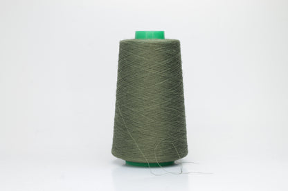 Fine, single-ply linen yarn in a rich Army. Reveals a crisp texture and subtle natural sheen, typical of pure linen fiber.