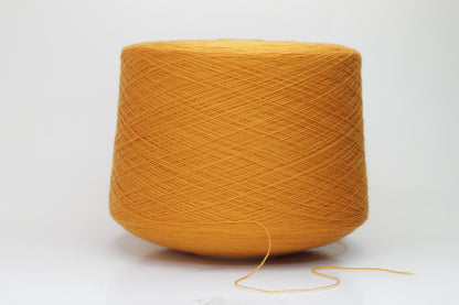 Close-up view of a vibrant orange Zegna Baruffa Merino yarn skein, showcasing the dense ply twist and smooth, fluffy texture with subtle sheen reflecting light.