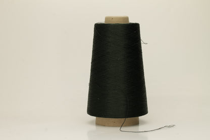 Close-up of a skein of dark green 100% silk yarn, showcasing its fine, smooth three-ply structure and elegant high sheen. The deep Autunno shade appears rich and consistent.
