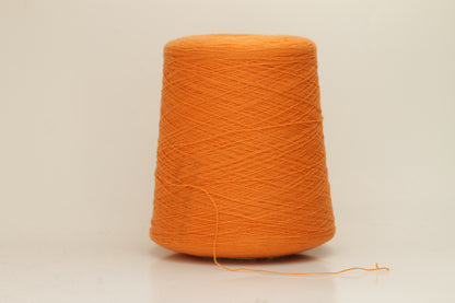 Close-up of fluffy, deeply saturated Jaffa orange cashmere yarn, showing its soft, slightly twisted two-ply structure and delicate sheen.