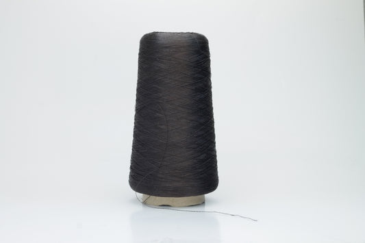 Coiled skein of single-ply, fine gauge silk yarn in a soft, bright sky blue. It exhibits a subtle, natural sheen with a smooth texture.