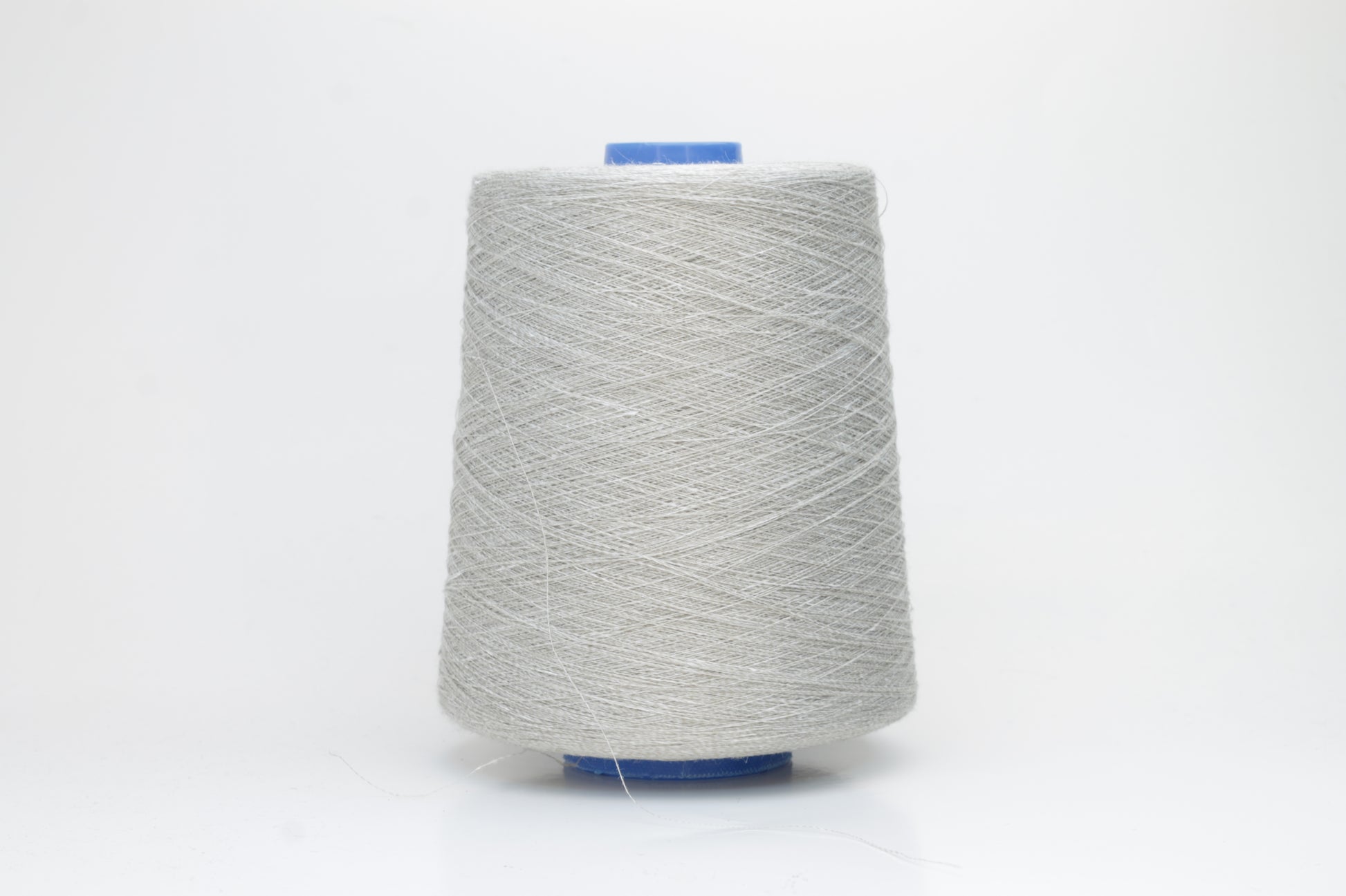 Fine, single-ply linen yarn in a rich charcoal gray. Reveals a crisp texture and subtle natural sheen, typical of pure linen fiber.