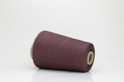 A finely spun, smooth cotton yarn, tightly plied, showcasing a muted, elegant dusty violet taupe color with a subtle matte sheen. No visible fluff.
