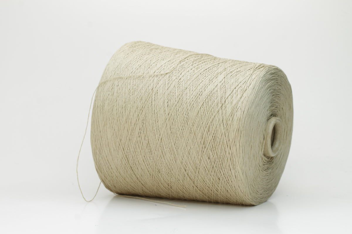 A soft, matte-finish yarn in a delicate light khaki beige, consisting of four finely twisted plies, offering a smooth, even texture.