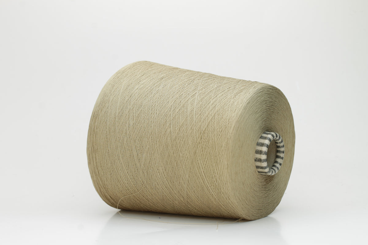 Close-up of finely spun Khaki Beige Heather 100% cotton yarn, exhibiting a soft, matte sheen and a gentle two-ply twist. The sophisticated blend of khaki and beige fibers creates a nuanced, earthy tone.