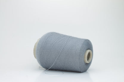Denim Blue 2-ply Alpaca Merino yarn, softly twisted with a gentle halo and subtle sheen, showcasing its deep, luxurious color saturation.