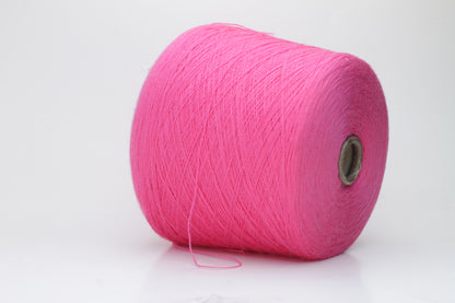 Close-up view of vibrant hot pink Zegna Baruffa Merino Cashwool yarn, showcasing its smooth, twisted ply structure and rich color depth.