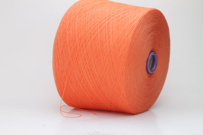 Close-up view of vibrant orange Merino 100% Cashwool yarn, showcasing a tight ply twist and a dense, fluffy texture with subtle sheen.