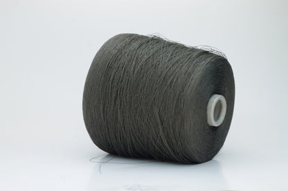 Skein of finely spun yarn, a muted artichoke green. Its smooth, even twist reveals the crisp texture of linen with a subtle, natural sheen. Low fluff, clean look.