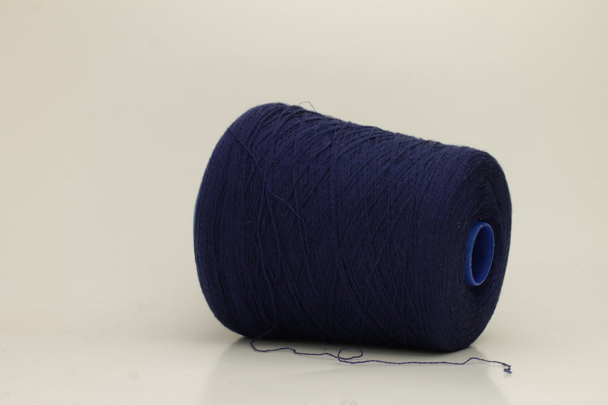 Rich, White 2-ply yarn with a fine, smooth twist; exhibits a subtle sheen and incredibly soft, uniform texture.