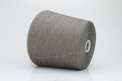 Close-up shot of Zegna Baruffa Merino 100% Cashwool Yarn in Taupe, showcasing a dense ply twist and fine thread structure with subtle sheen and a fluffy texture.